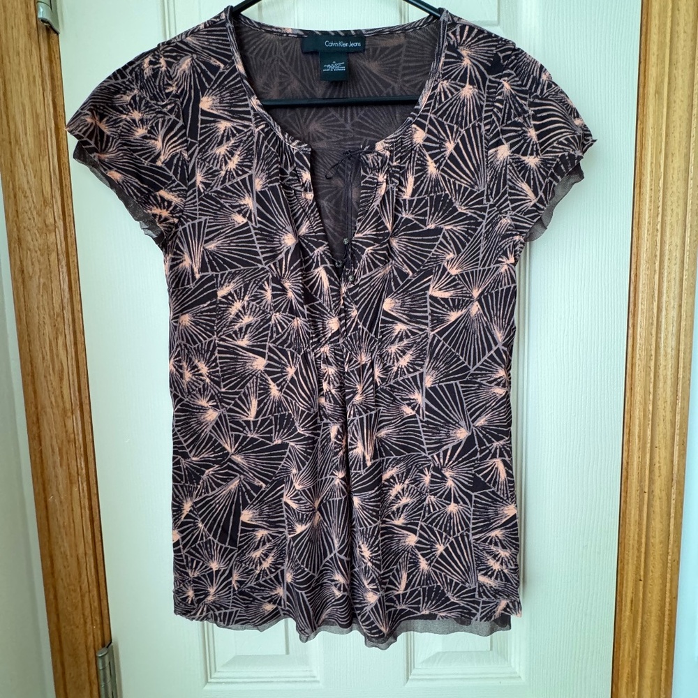 Calvin Klein nylon top with poliamida lining or sheer under layer.